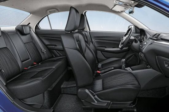 Interior view of the 2018 Suzuki Dzire displaying both the front and rear seating areas.