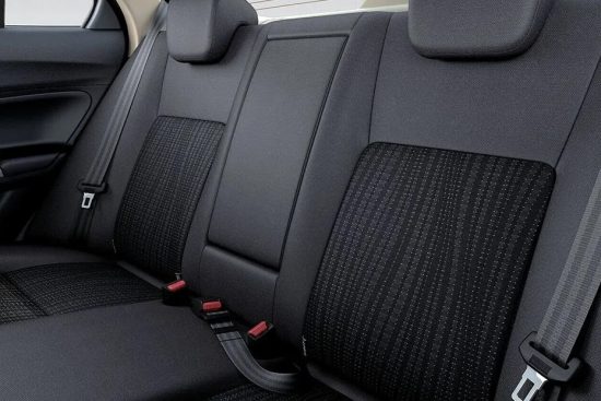 View of the 2018 Suzuki Dzire's rear seats highlighting the upholstery and legroom.